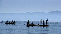 Fishing canoes in bright haze on the southeast arm of Lake Malawi